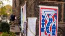 Voting signs in Philadelphia in 2021. In odd-year elections like these, many local candidates cross-file.