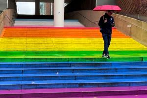 A rainbow-colored staircase mural.