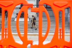 Law enforcement has erected orange fencing and deployed armed officers outside the Pennsylvania State Capitol.