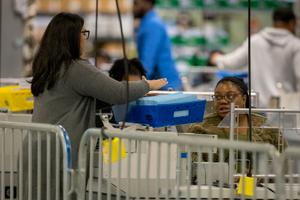 Mail-in ballots were processed in Philadelphia before going to flattening station.